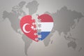 Puzzle heart with the national flag of turkey and netherlands on a world map background. Concept Royalty Free Stock Photo