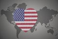 Puzzle heart with the national flag of united states of america on a world map background Royalty Free Stock Photo