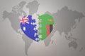 Puzzle heart with the national flag of zambia and australia on a world map background. Concept Royalty Free Stock Photo
