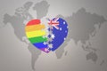 Puzzle heart with the rainbow gay flag and australia on a world map background. Concept Royalty Free Stock Photo