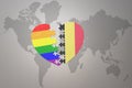 Puzzle heart with the rainbow gay flag and belgium on a world map background. Concept Royalty Free Stock Photo