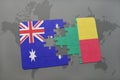 puzzle with the national flag of australia and benin on a world map background. Royalty Free Stock Photo