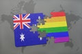 puzzle with the national flag of australia and rainbow gay flag on a world map background. Royalty Free Stock Photo