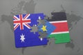 puzzle with the national flag of australia and south sudan on a world map background. Royalty Free Stock Photo