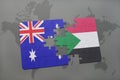 puzzle with the national flag of australia and sudan on a world map background. Royalty Free Stock Photo