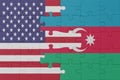 puzzle with the national flag of azerbaijan and united states of america. macro