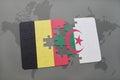 puzzle with the national flag of belgium and algeria on a world map background. Royalty Free Stock Photo