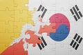 Puzzle with the national flag of bhutan and south korea Royalty Free Stock Photo