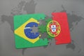 puzzle with the national flag of brazil and portugal on a world map background. Royalty Free Stock Photo