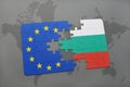 Puzzle with the national flag of bulgaria and european union on a world map background. Royalty Free Stock Photo