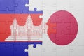 Puzzle with the national flag of cambodia and japan
