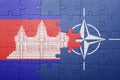 Puzzle with the national flag of cambodia and nato