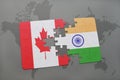 puzzle with the national flag of canada and india on a world map background. Royalty Free Stock Photo