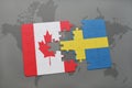 puzzle with the national flag of canada and sweden on a world map background. Royalty Free Stock Photo