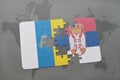 puzzle with the national flag of canary islands and serbia on a world map background. Royalty Free Stock Photo