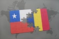 puzzle with the national flag of chile and romania on a world map background.