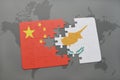 puzzle with the national flag of china and cyprus on a world map background. Royalty Free Stock Photo