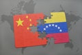 puzzle with the national flag of china and venezuela on a world map background.