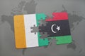 puzzle with the national flag of cote divoire and libya on a world map