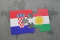 puzzle with the national flag of croatia and kurdistan on a world map