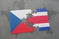 puzzle with the national flag of czech republic and costa rica on a world map Royalty Free Stock Photo