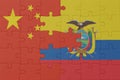 puzzle with the national flag of ecuador and china . macro.concept