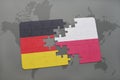 puzzle with the national flag of germany and poland on a world map background. Royalty Free Stock Photo