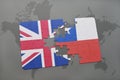 puzzle with the national flag of great britain and chile on a world map background.