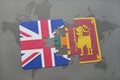 Puzzle with the national flag of great britain and sri lanka on a world map background.