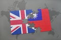 Puzzle with the national flag of great britain and taiwan on a world map background.