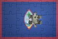 puzzle with the national flag of guam and usa dollar banknote. finance concept Royalty Free Stock Photo