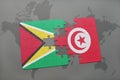 puzzle with the national flag of guyana and tunisia on a world map