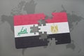 puzzle with the national flag of iraq and egypt on a world map background.