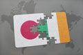 puzzle with the national flag of japan and ireland on a world map background. Royalty Free Stock Photo