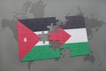 puzzle with the national flag of jordan and palestine on a world map background.