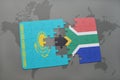 puzzle with the national flag of kazakhstan and south africa on a world map Royalty Free Stock Photo