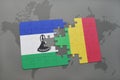 puzzle with the national flag of lesotho and mali on a world map Royalty Free Stock Photo