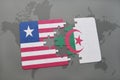 puzzle with the national flag of liberia and algeria on a world map Royalty Free Stock Photo