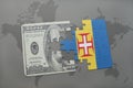 puzzle with the national flag of madeira and dollar banknote on a world map background. Royalty Free Stock Photo