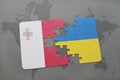 puzzle with the national flag of malta and ukraine on a world map background. Royalty Free Stock Photo