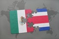 puzzle with the national flag of mexico and costa rica on a world map background. Royalty Free Stock Photo