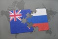 puzzle with the national flag of new zealand and russia on a world map background