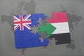 puzzle with the national flag of new zealand and sudan on a world map background. Royalty Free Stock Photo