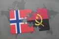 puzzle with the national flag of norway and angola on a world map Royalty Free Stock Photo