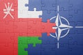 Puzzle with the national flag of oman and nato