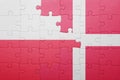 Puzzle with the national flag of poland and denmark