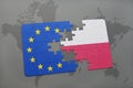 Puzzle with the national flag of poland and european union on a world map background.