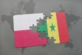 puzzle with the national flag of poland and senegal on a world map background. Royalty Free Stock Photo