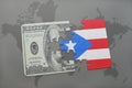 puzzle with the national flag of puerto rico and dollar banknote on a world map background. Royalty Free Stock Photo