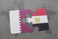 puzzle with the national flag of qatar and egypt on a world map background.